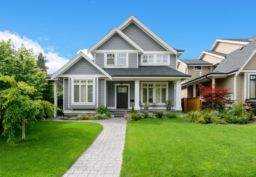 Medium-Sized Home with Shingles and Dark Grey Roof