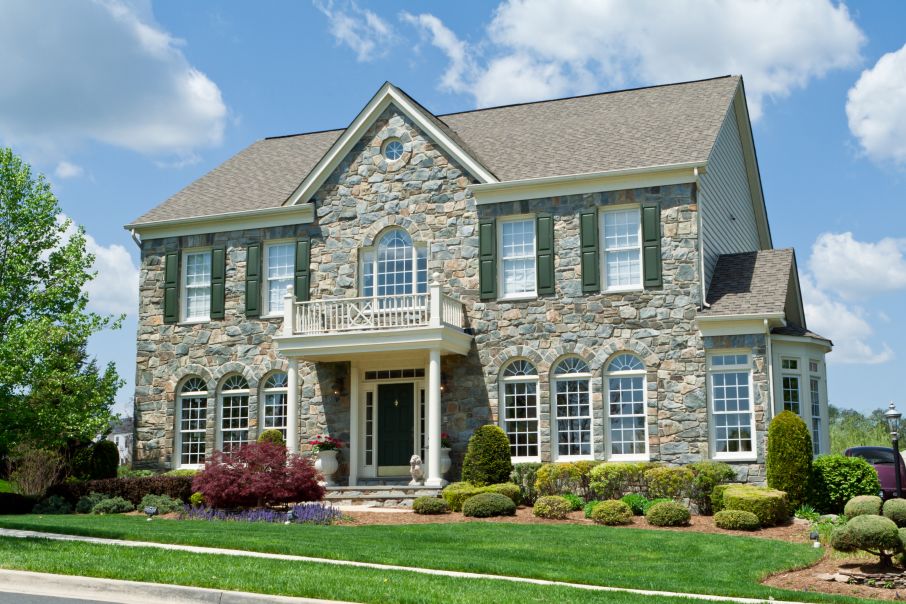 Gray Stone French Country Home with Gable Roof