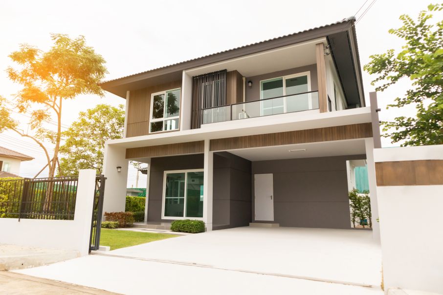 Modern Gray Stucco Home with Dark Grey Tile Roof