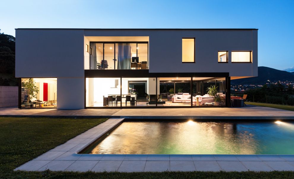 Modern Medium-Sized Stucco House with Black Roof