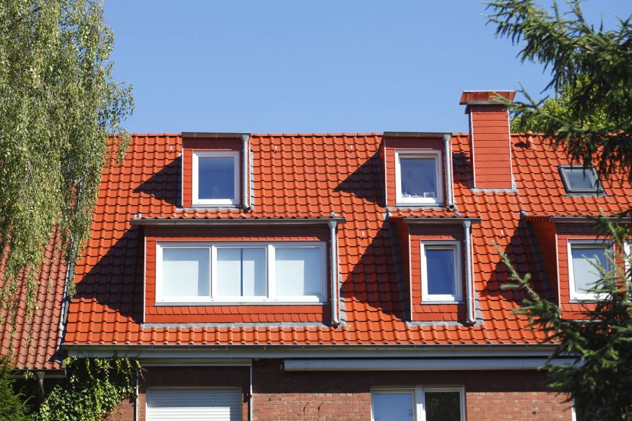 Medium-sized Eclectic Red Clay Roof with Unique Architectural Design